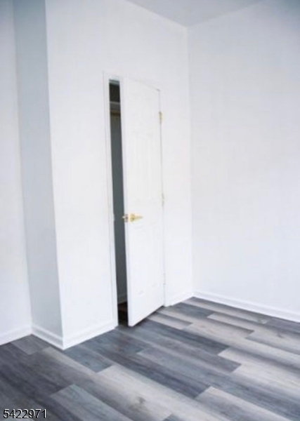5 Timothy Street, Unit 4 Paterson, NJ 07503 - Photo 4 of 16 a view of a room with wooden floor