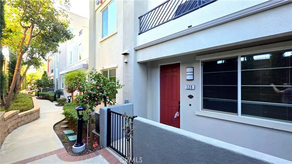 a potted plant sitting in front of a building