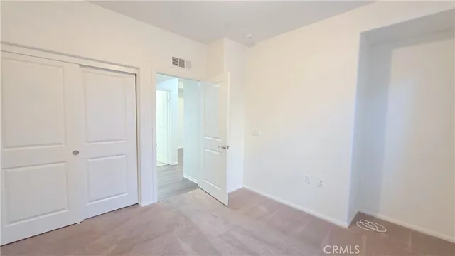 a bathroom with a toilet and a bathtub