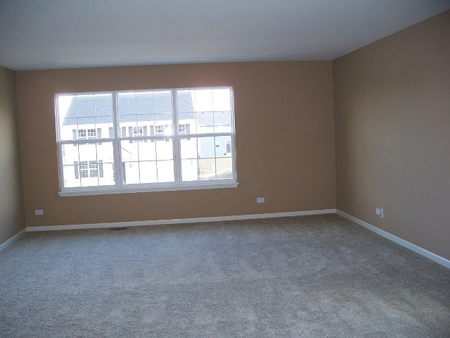 2694 Reedgrass Way Wauconda, IL 60084 - Photo 5 of 12 an empty room with a window