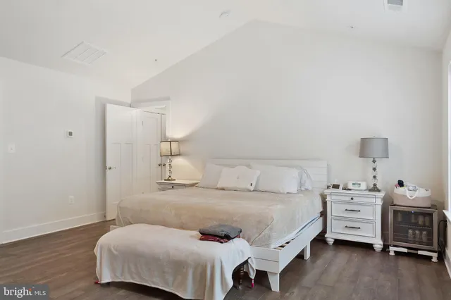 a bedroom with a bed and a couch