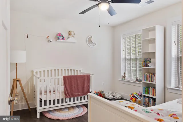 a bedroom with furniture and a book shelf