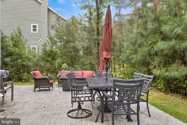 a view of a chairs and table in patio