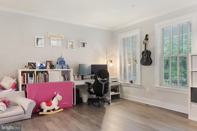 a livingroom with a workspace