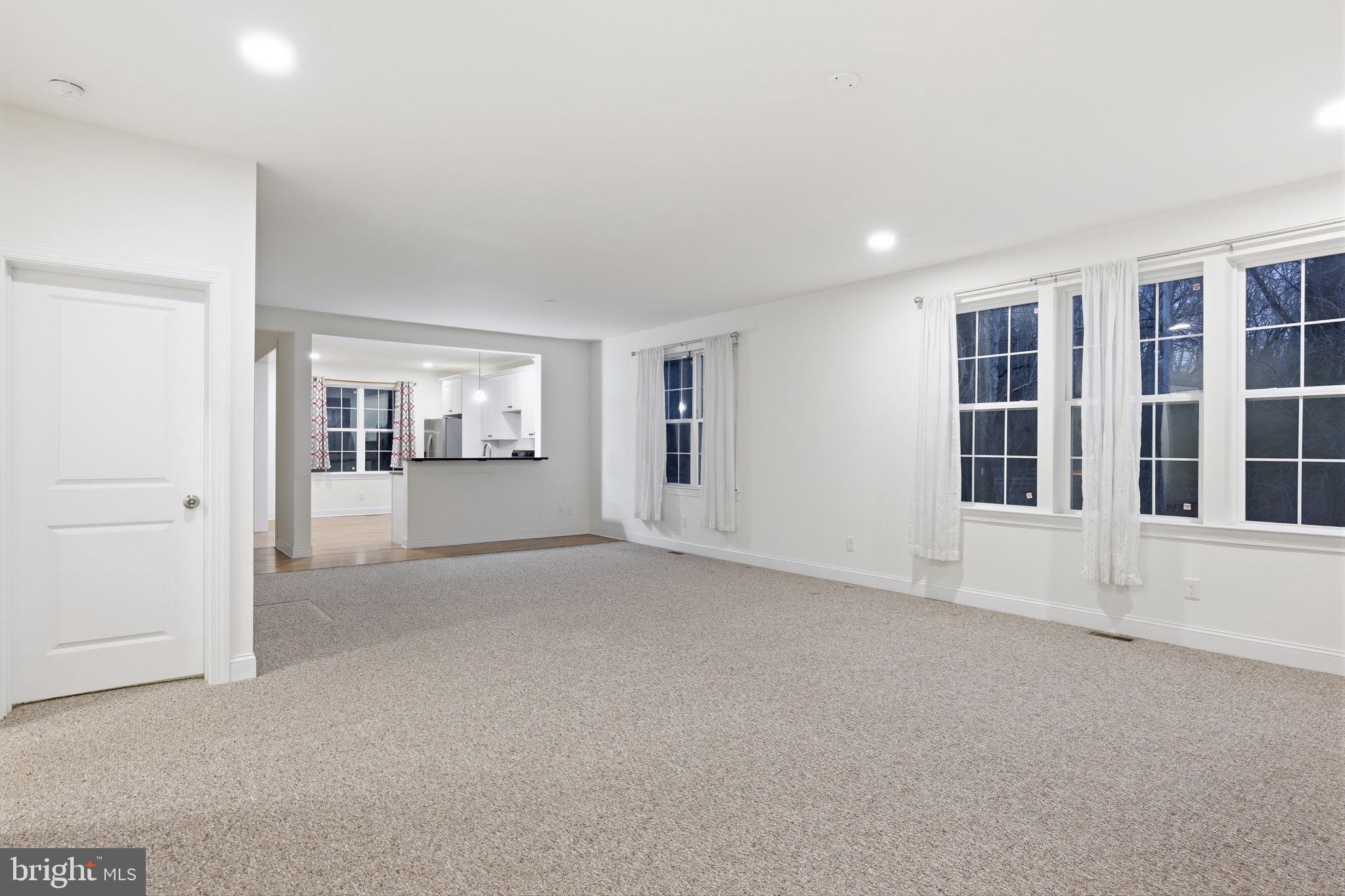 588 Almshouse Road Doylestown, PA 18901 - Photo 11 of 31 an empty room with windows and pillars in it