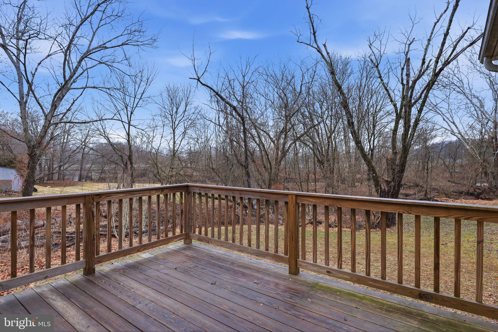 588 Almshouse Road Doylestown, PA 18901 - Photo 15 of 31 a balcony with wooden floor and fence