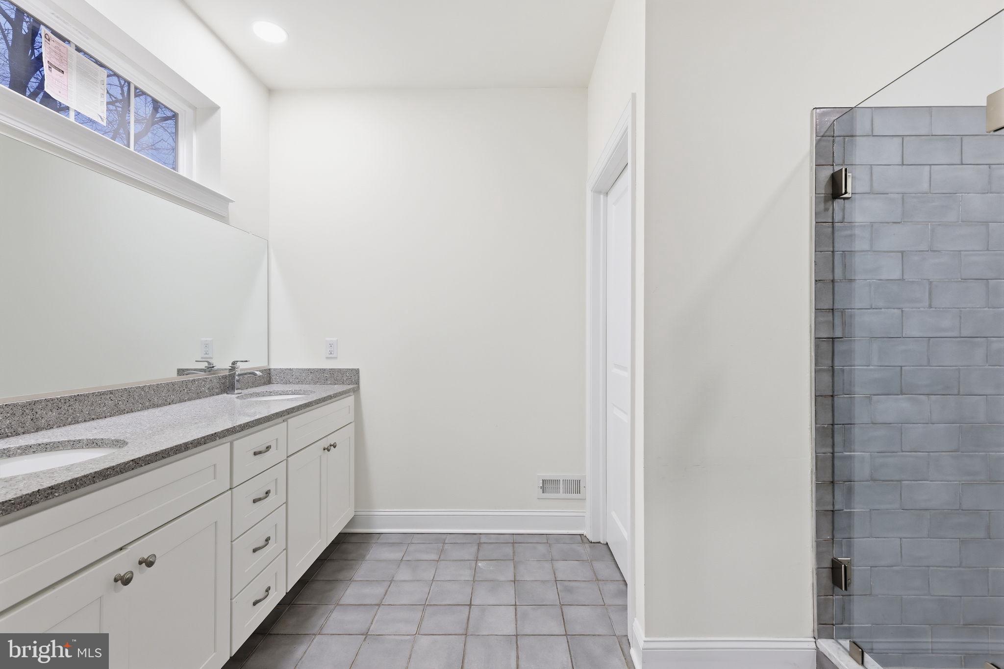 588 Almshouse Road Doylestown, PA 18901 - Photo 20 of 31 a bathroom with a granite countertop sink and a mirror