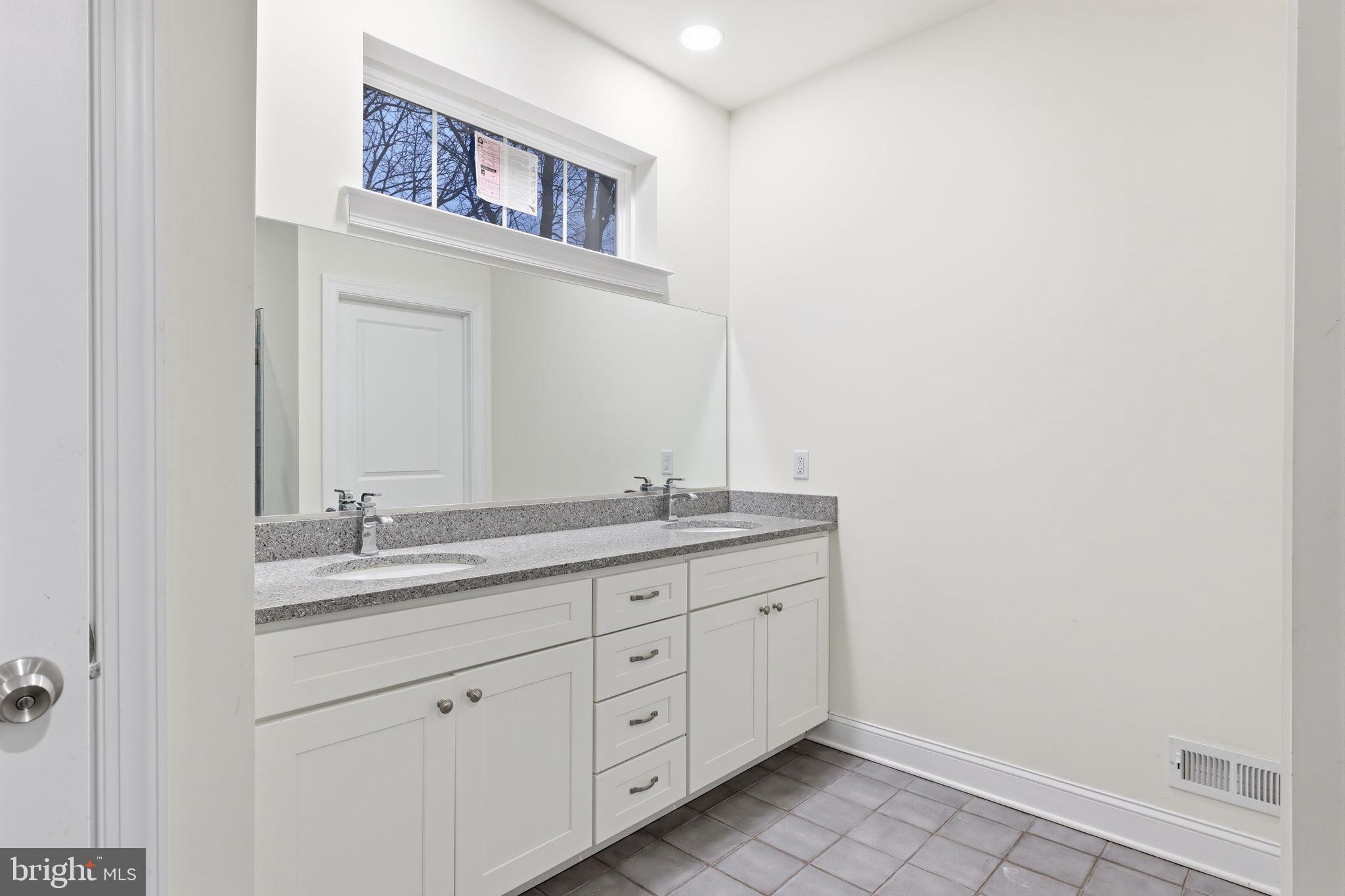 588 Almshouse Road Doylestown, PA 18901 - Photo 21 of 31 a bathroom with a granite countertop sink and a mirror