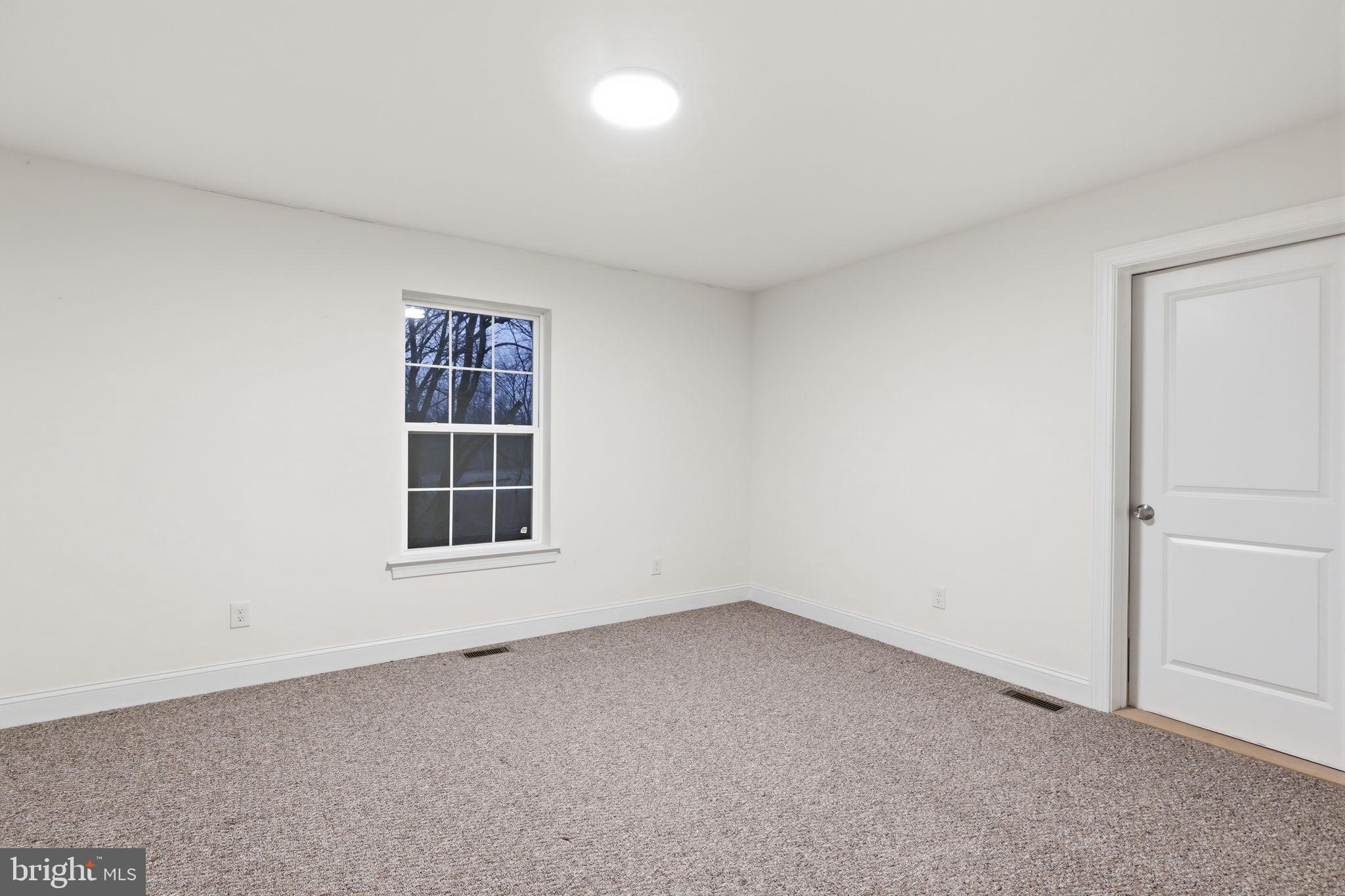 588 Almshouse Road Doylestown, PA 18901 - Photo 23 of 31 an empty room with a window