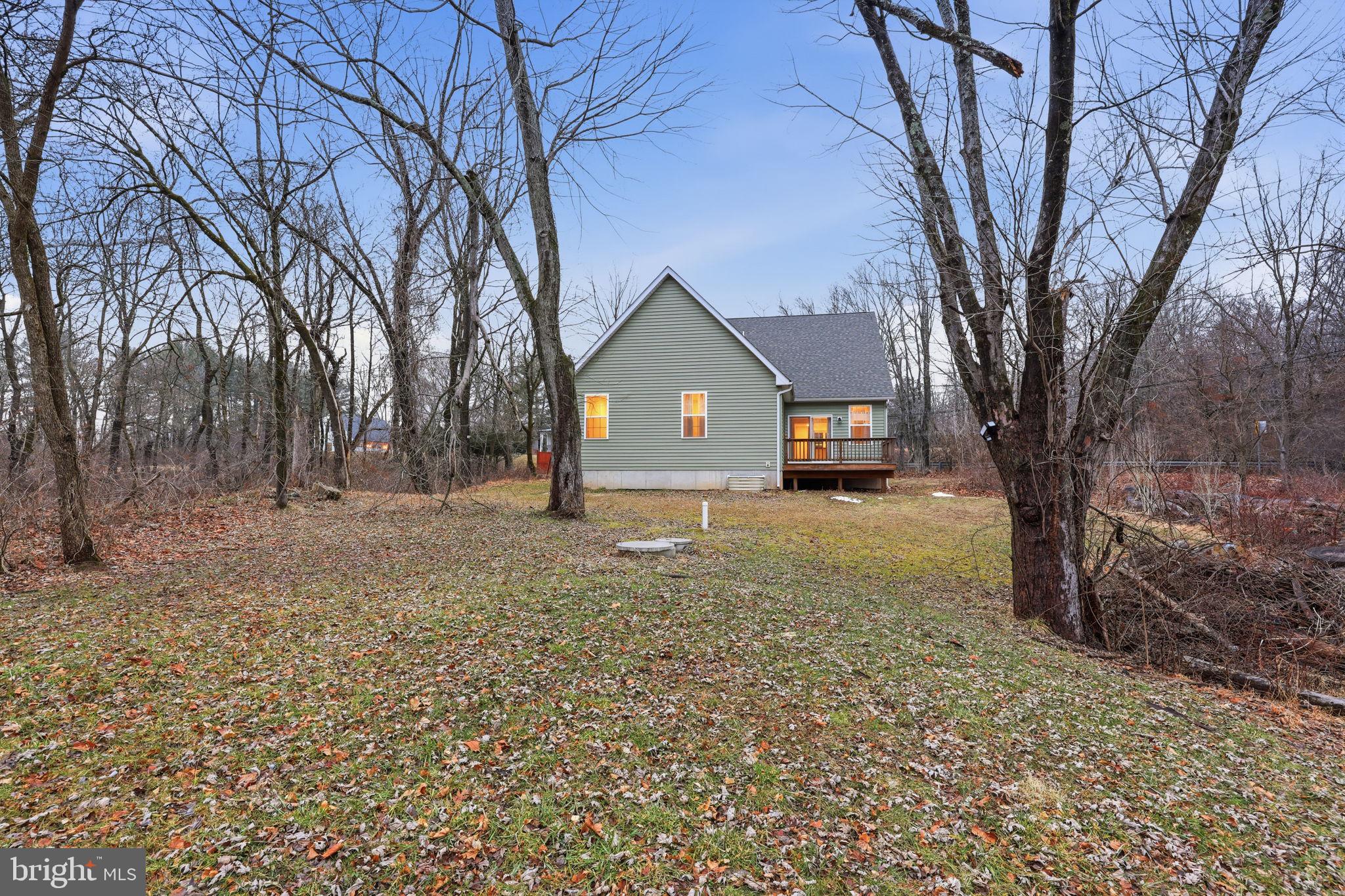588 Almshouse Road Doylestown, PA 18901 - Photo 5 of 31 a front view of a house with a yard and garage