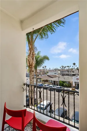 a view of a balcony with chairs