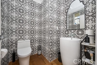 340 5th Street Huntington Beach, CA 92648 - Photo 14 of 48 a bathroom with a toilet and a sink