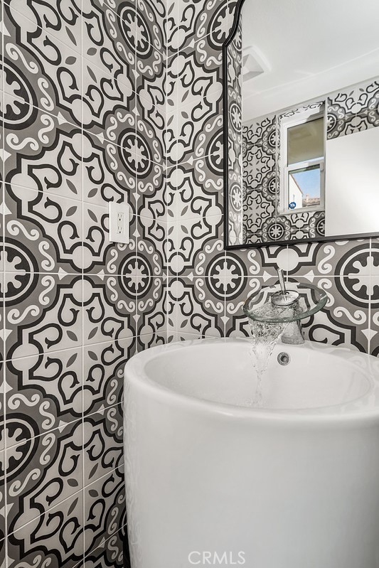 340 5th Street Huntington Beach, CA 92648 - Photo 15 of 48 a bathroom with a sink and a mirror