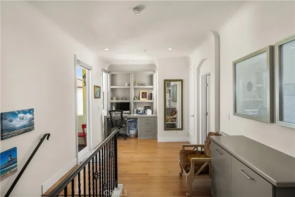 a view of a workspace with furniture and entryway