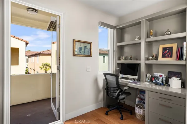 a workspace with furniture and wooden floor