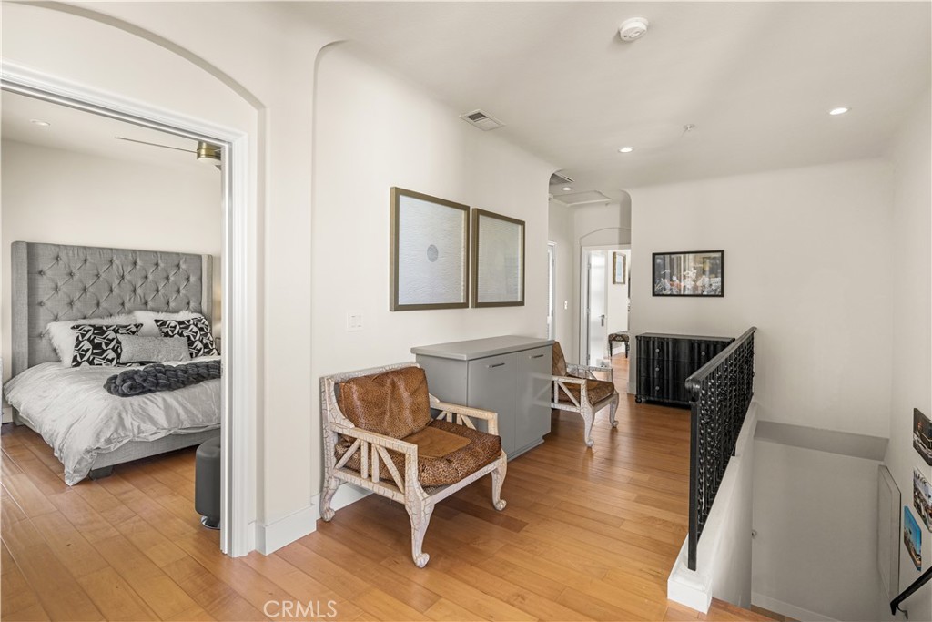 340 5th Street Huntington Beach, CA 92648 - Photo 20 of 48 a living room with furniture and a wooden floor