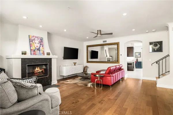 a living room with furniture or flat screen tv and a fireplace
