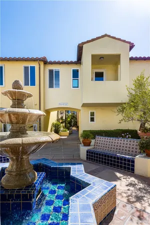 a front view of a house with outdoor seating