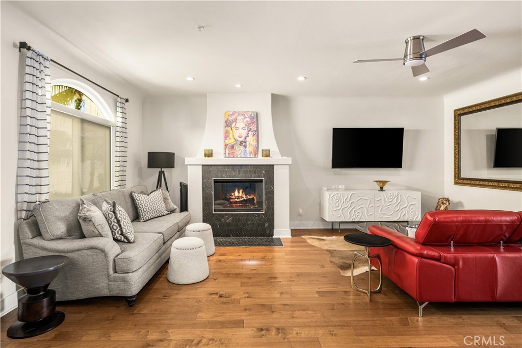 340 5th Street Huntington Beach, CA 92648 - Photo 4 of 48 a living room with furniture and a flat screen tv