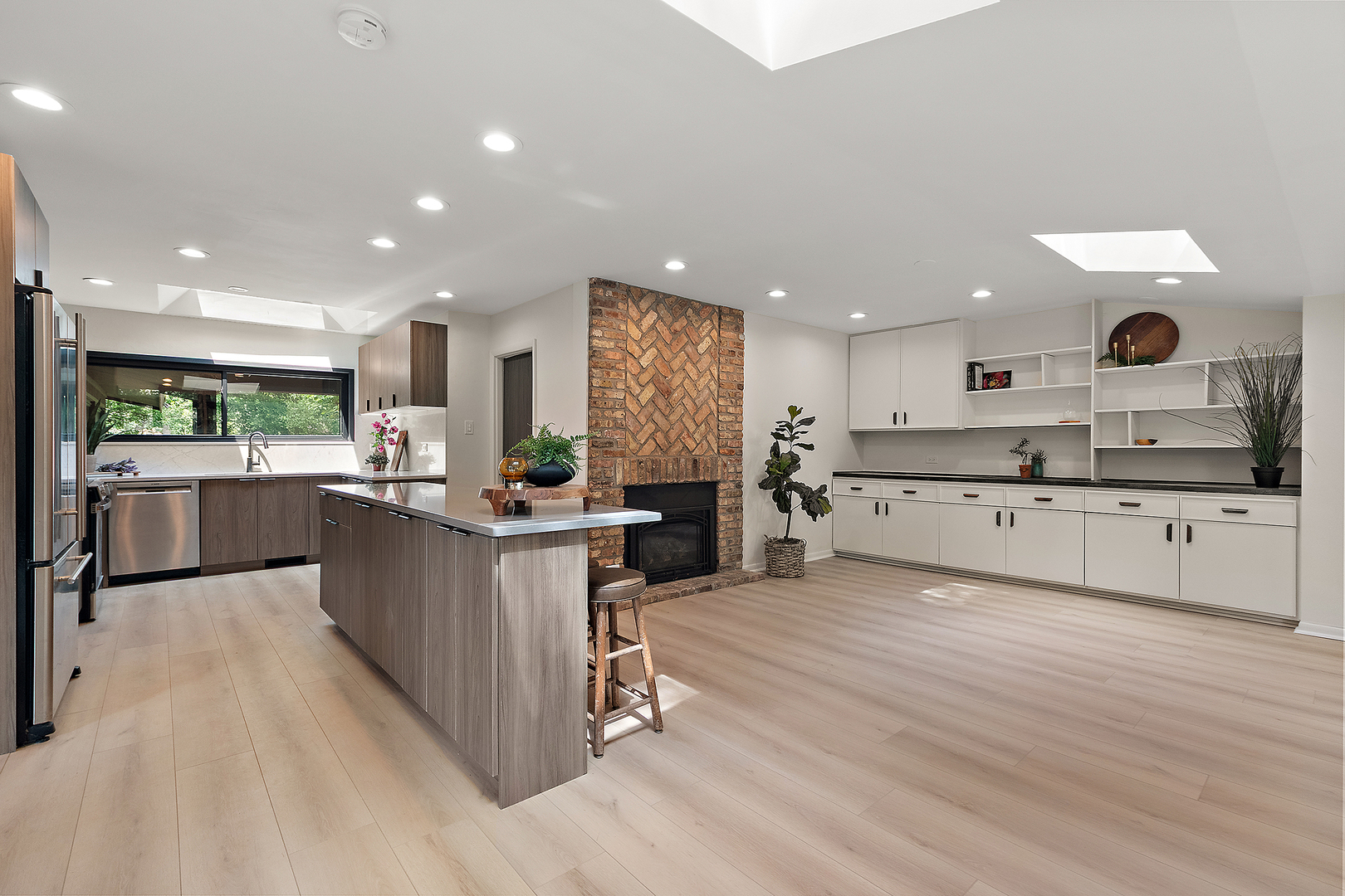 71 Graymoor Lane Olympia Fields, IL 60461 - Photo 14 of 36 a large kitchen with stainless steel appliances kitchen island a large counter top and a stove top oven