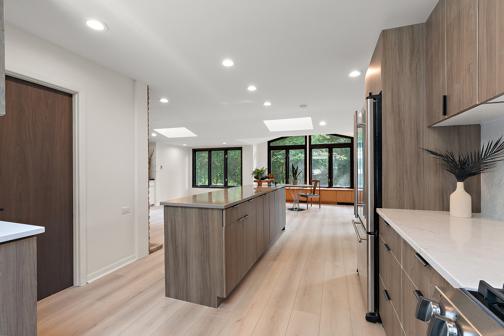 71 Graymoor Lane Olympia Fields, IL 60461 - Photo 17 of 36 a large kitchen with kitchen island a large counter space a sink a window and stainless steel appliances