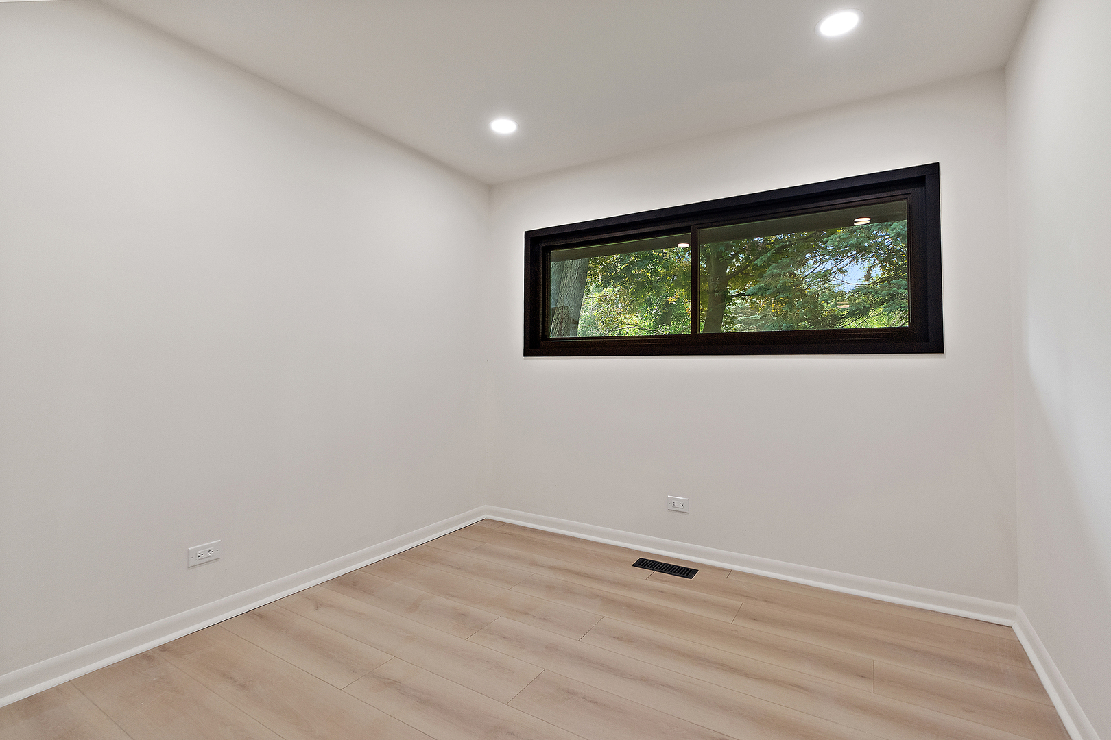 71 Graymoor Lane Olympia Fields, IL 60461 - Photo 26 of 36 an empty room with wooden floor and windows