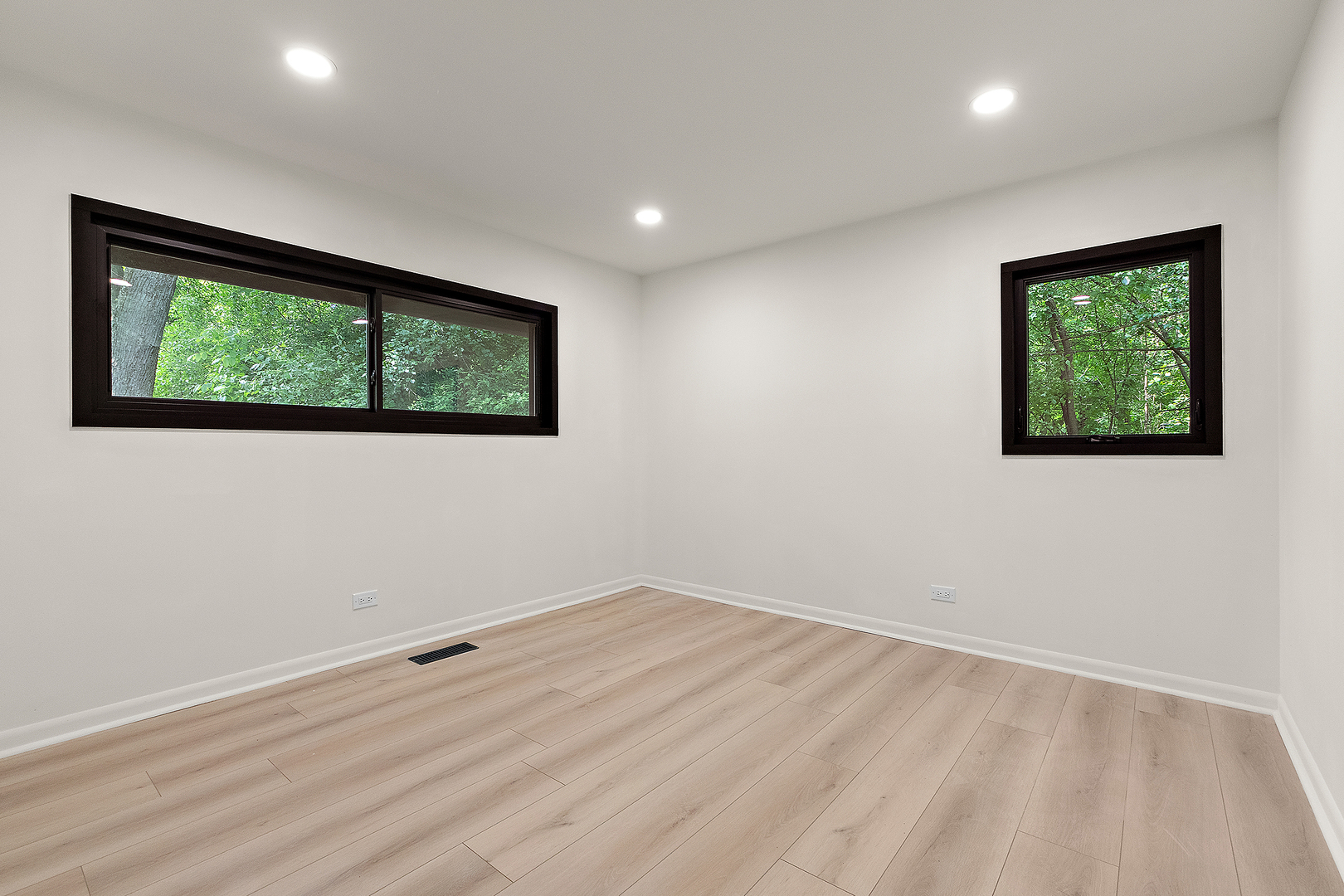 71 Graymoor Lane Olympia Fields, IL 60461 - Photo 28 of 36 a view of an empty room with wooden floor and a window