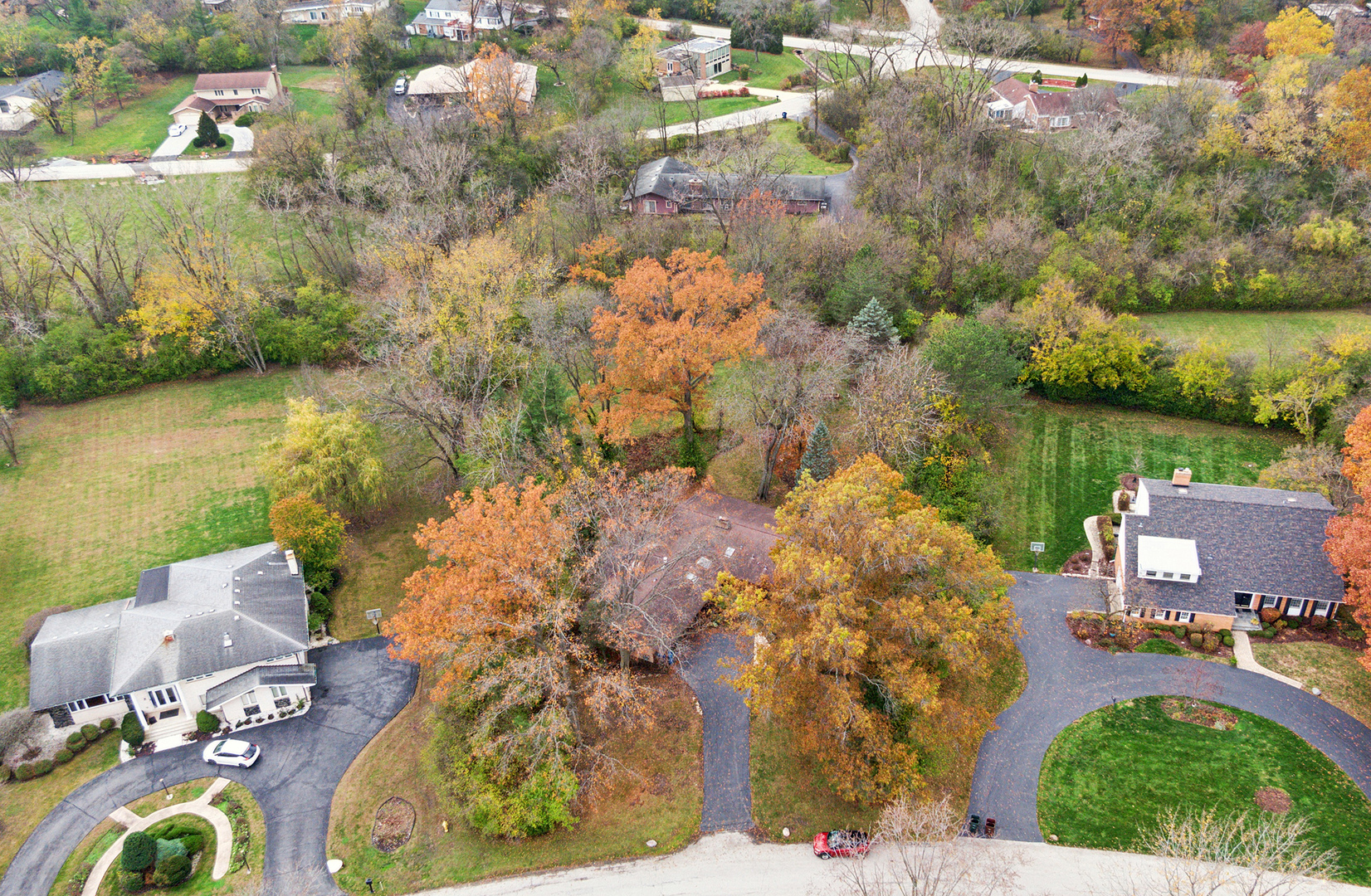 71 Graymoor Lane Olympia Fields, IL 60461 - Photo 35 of 36 a view of a lake with lawn chairs and large trees