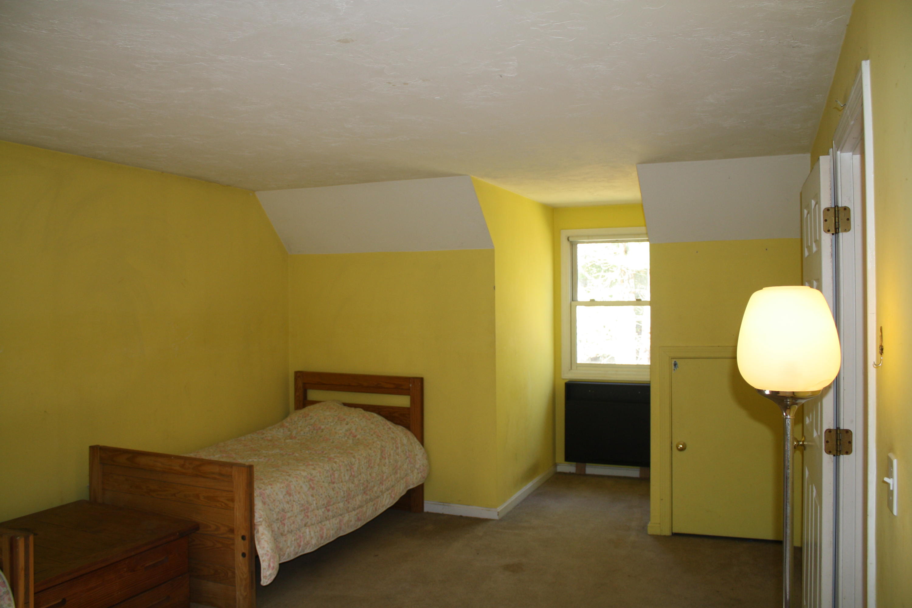 207 Simon Narrows Road Mashpee, MA 02649 - Photo 15 of 18 a bedroom with a bed and cabinets