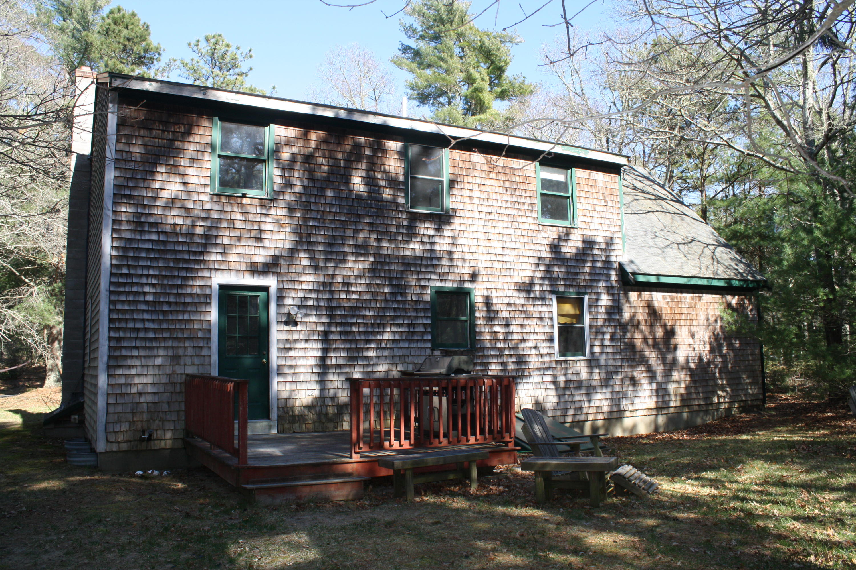 207 Simon Narrows Road Mashpee, MA 02649 - Photo 3 of 18 a front view of a house with a yard