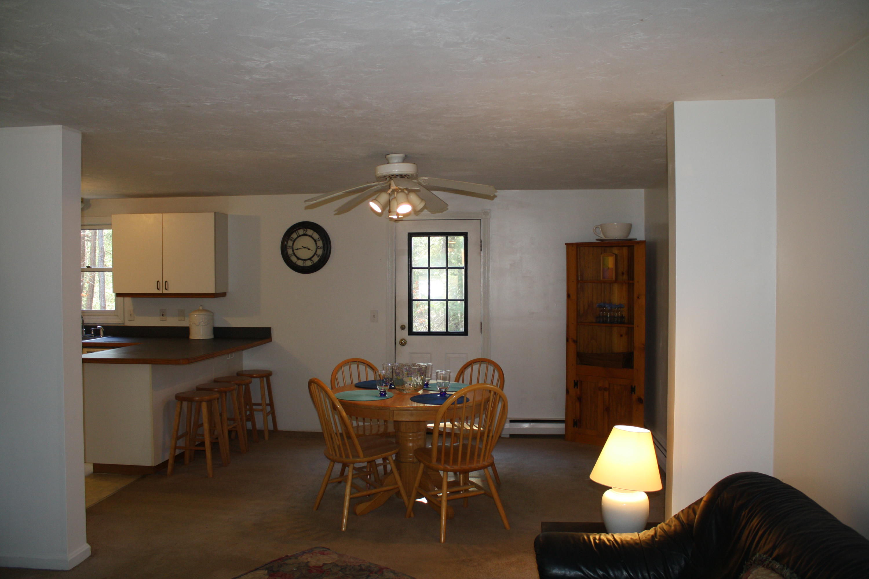 207 Simon Narrows Road Mashpee, MA 02649 - Photo 5 of 18 a dining room with furniture and window