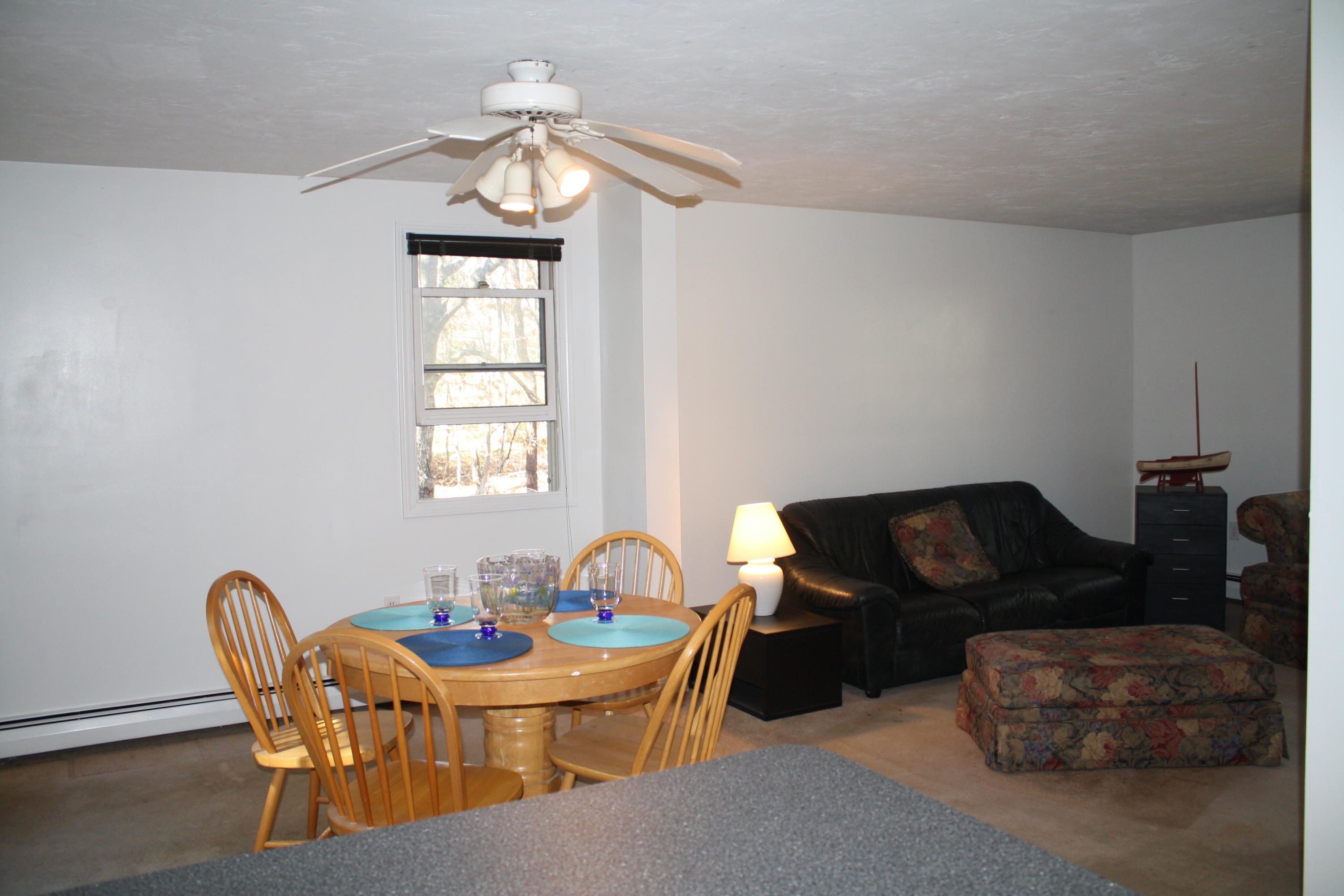 207 Simon Narrows Road Mashpee, MA 02649 - Photo 6 of 18 a living room with furniture a table and a window