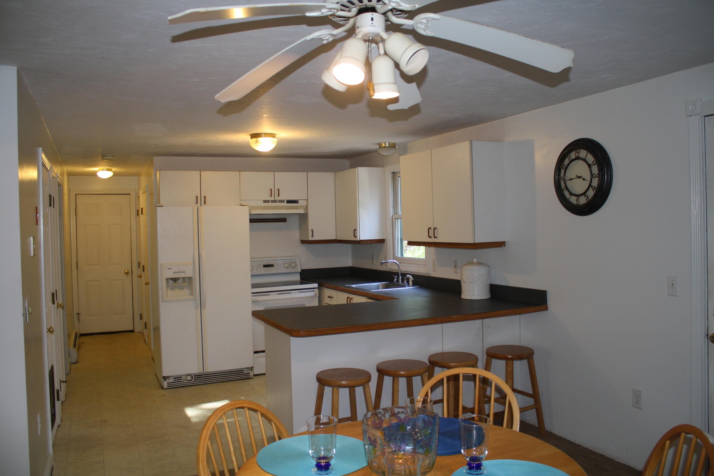 207 Simon Narrows Road Mashpee, MA 02649 - Photo 8 of 18 a kitchen with stainless steel appliances granite countertop a refrigerator a stove and a sink