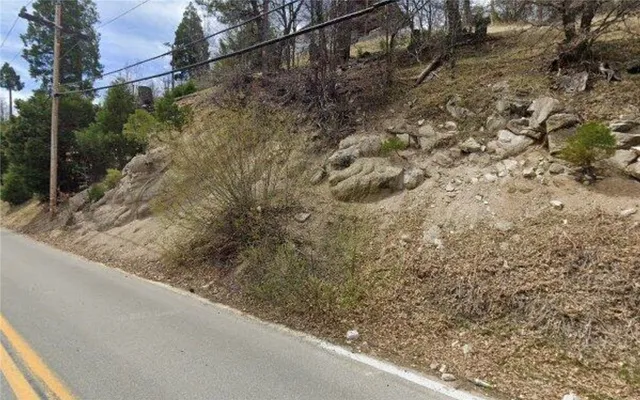 a view of a yard from a balcony