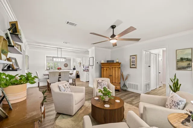 a room with a washing machine and utility room with wooden floor