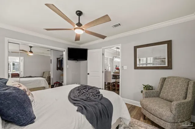 a view of a deck with wooden floor and outdoor seating
