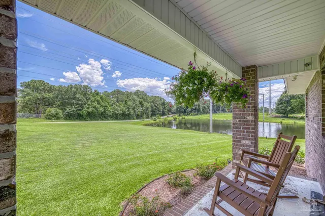 a view of a lake with a yard