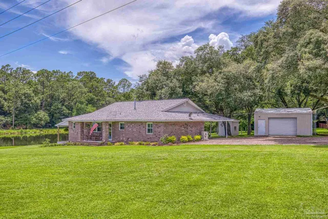 a front view of a house with garden