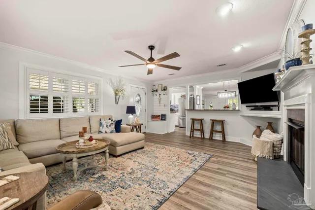 a living room with furniture and a flat screen tv