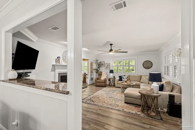 a kitchen with a granite countertop sink and cabinets