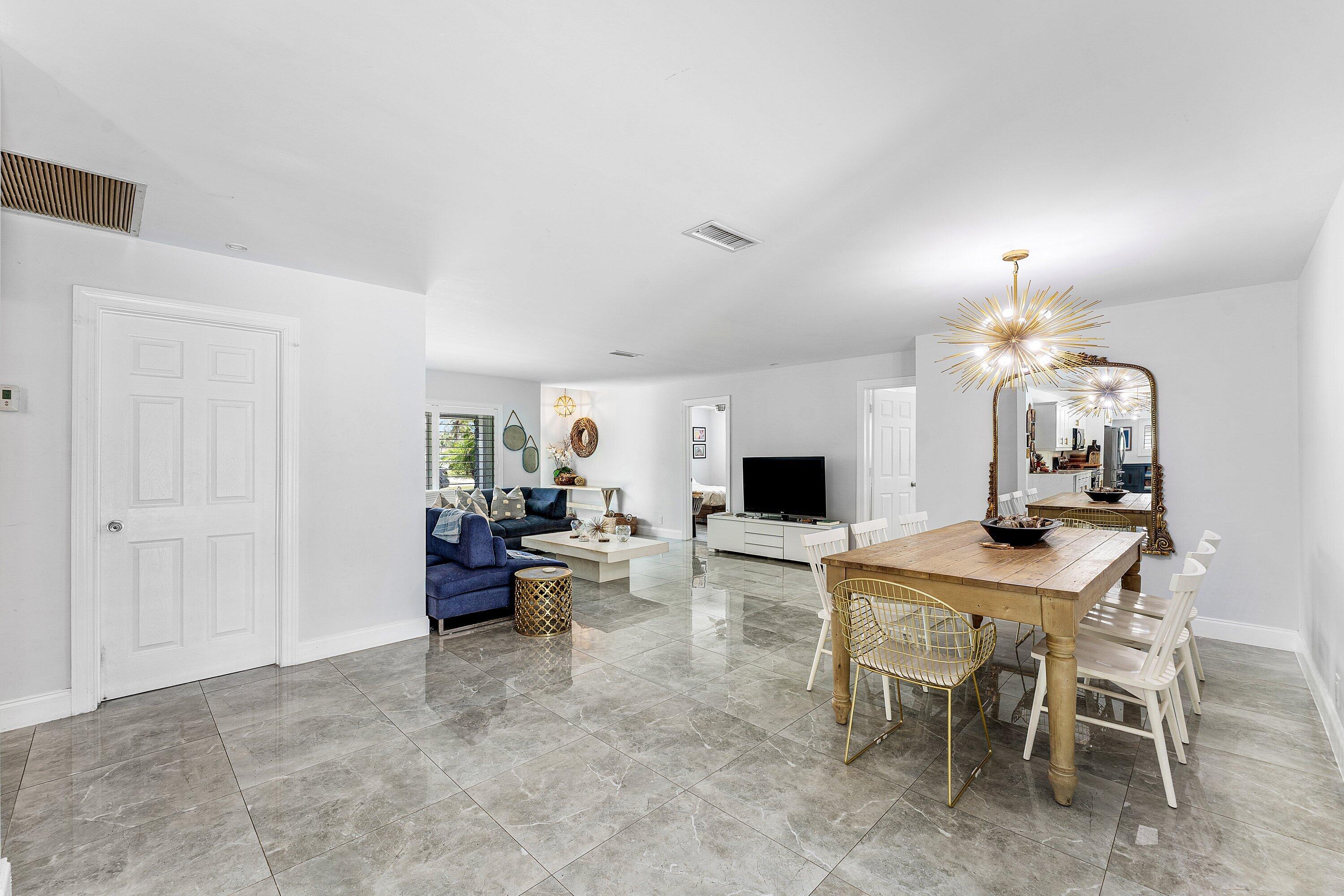 581 Northwest 13th Drive Boca Raton, FL 33486 - Photo 14 of 39 a view of a livingroom with furniture and a flat screen tv