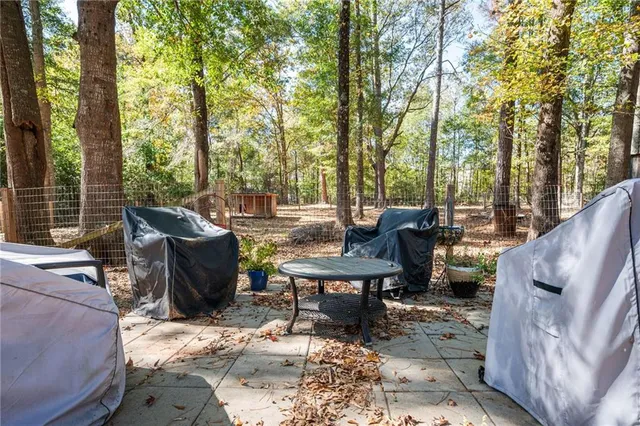 a view of a patio with iron fence