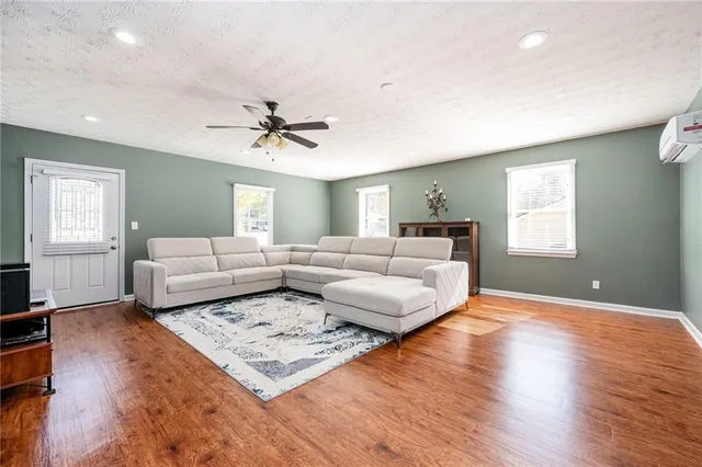 a living room with furniture rug and window