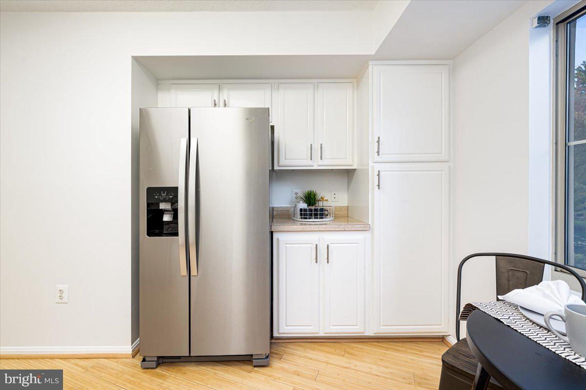14805 Pennfield Circle, Unit 201 Silver Spring, MD 20906 - Photo 13 of 47 a kitchen with stainless steel appliances a refrigerator sink and cabinets