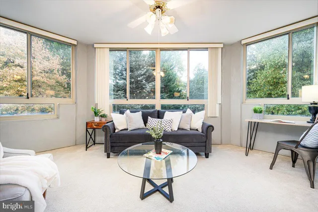 a living room with furniture and a window