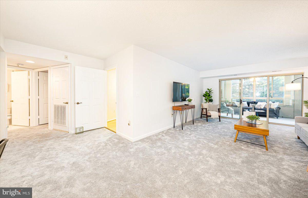 14805 Pennfield Circle, Unit 201 Silver Spring, MD 20906 - Photo 6 of 47 a view of livingroom with furniture and wooden floor