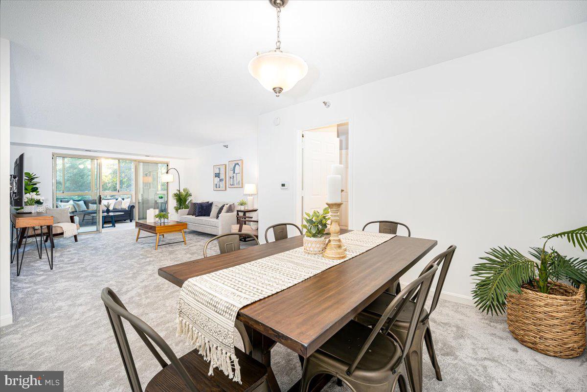 14805 Pennfield Circle, Unit 201 Silver Spring, MD 20906 - Photo 9 of 47 a view of a dining room with furniture