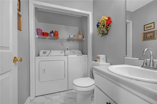 a bathroom with a sink and toilet