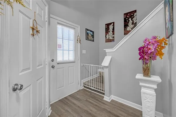 a view of entryway with wooden floor