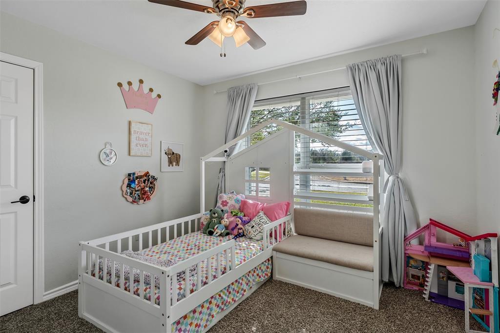 300 Rash Lane Terrell, TX 75160 - Photo 20 of 28 a bedroom with furniture and a large window